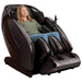 Kyota Hatsumei M900AI 4D Massage Chair in Brown with woman sitting