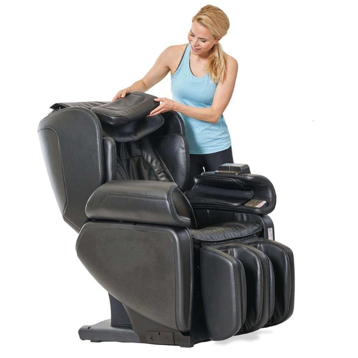 Synca Kurodo E - Premium Commercial Massage Chair with woman checking the chair.