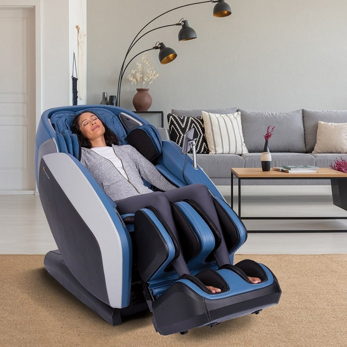 Human Touch Certus Massage Chair in Sky with Woman Sitting Inside the House
