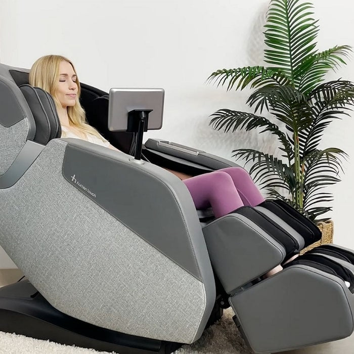 Human Touch Wholebody Rove Massage Chair with woman relaxing.