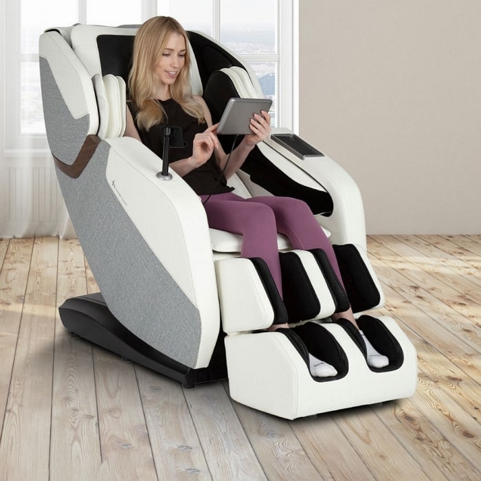 Human Touch Wholebody Rove Massage Chair with woman sitting.