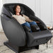 Kyota Kaizen M680 Massage Chair in Black with Woman Relaxing