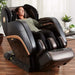 Kyota Kokoro M888 4D Massage Chair in Black Brown with Woman Relaxing