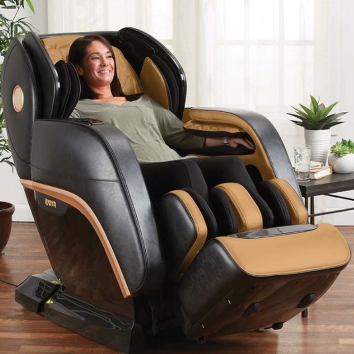Kyota Kokoro M888 4D Massage Chair in Brown Saddle with Woman Relaxing
