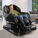 Kyota Yosei M868 4D Massage Chair in Black with Man Relaxing