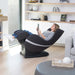Positive Posture Sol Massage Chair inside a room with person using a device in reclined position
