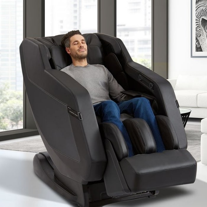 Sharper Image Relieve 3D Massage Chair with Man Sitting on the Chair